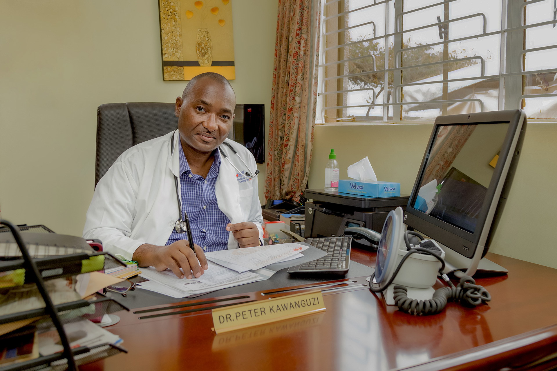 Dr. Peter Kawanguzi — Medical Director, Bugolobi Medical Centre